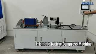 Macchina per l'impilaggio e la compressione di pacchi batteria prismatici